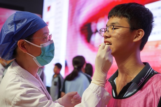 爱牙护齿 笑绽青春——我院走进南宁市第十四中学教育集团五象校区、天桃实验学校小学部明月校区开展2026年全国爱牙日医校共建公益活动 第 2 张